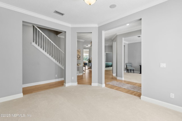 5698 Grand Cayman Rd, Jacksonville, FL 32226 - interior space with stairway, baseboards, visible vents, crown molding, and carpet flooring