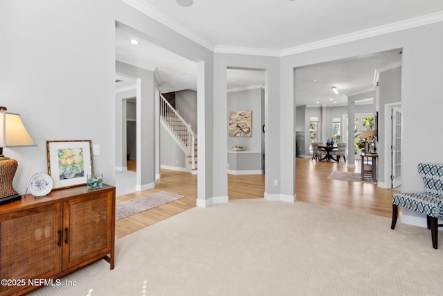 5698 Grand Cayman Rd, Jacksonville, FL 32226 - interior space with stairway, baseboards, ornamental molding, light carpet, and light wood-type flooring