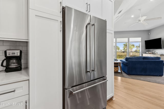 5698 Grand Cayman Rd, Jacksonville, FL 32226 - kitchen with a ceiling fan, decorative backsplash, light wood-style floors, high end refrigerator, and open floor plan