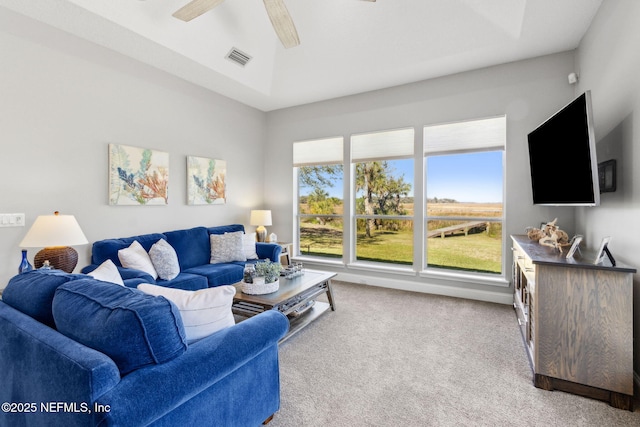 5698 Grand Cayman Rd, Jacksonville, FL 32226 - living area with visible vents, a ceiling fan, and carpet flooring