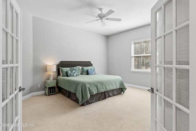 5698 Grand Cayman Rd, Jacksonville, FL 32226 - carpeted bedroom with french doors, baseboards, and ceiling fan