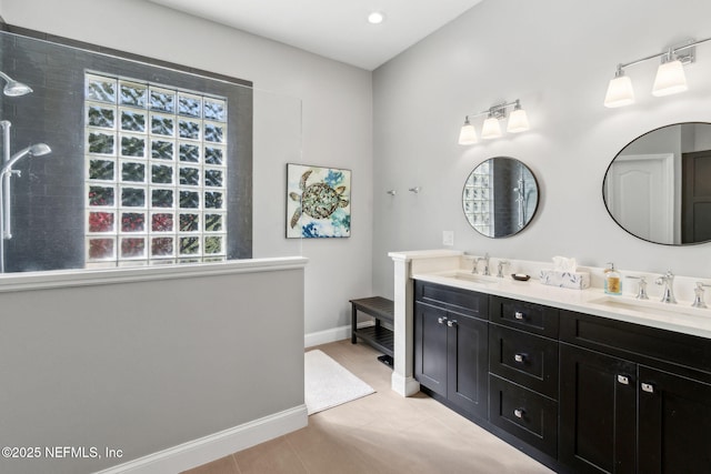 5698 Grand Cayman Rd, Jacksonville, FL 32226 - bathroom featuring a healthy amount of sunlight, baseboards, and a sink