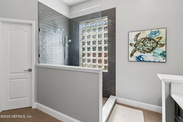 5698 Grand Cayman Rd, Jacksonville, FL 32226 - bathroom featuring a wealth of natural light, baseboards, and walk in shower