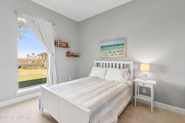 5698 Grand Cayman Rd, Jacksonville, FL 32226 - bedroom with light carpet and baseboards