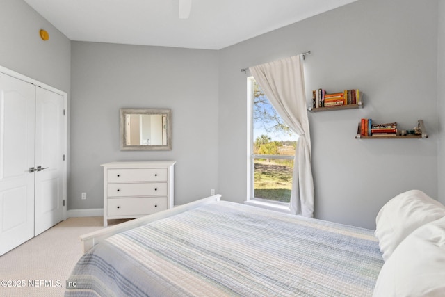 5698 Grand Cayman Rd, Jacksonville, FL 32226 - carpeted bedroom with a ceiling fan, baseboards, and a closet