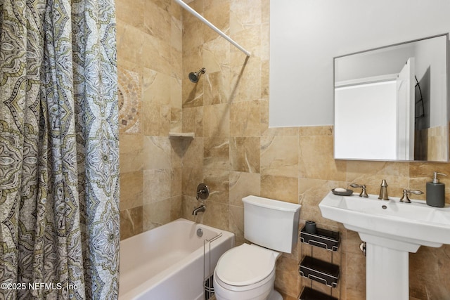 5698 Grand Cayman Rd, Jacksonville, FL 32226 - bathroom with toilet, tile walls, and shower / bath combo