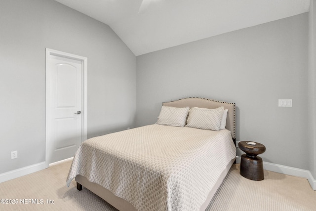 5698 Grand Cayman Rd, Jacksonville, FL 32226 - bedroom featuring baseboards, light carpet, and vaulted ceiling