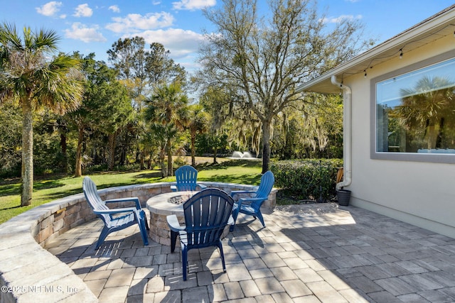 5698 Grand Cayman Rd, Jacksonville, FL 32226 - view of patio / terrace featuring an outdoor fire pit