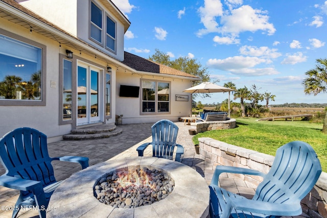 5698 Grand Cayman Rd, Jacksonville, FL 32226 - view of patio with french doors and a fire pit
