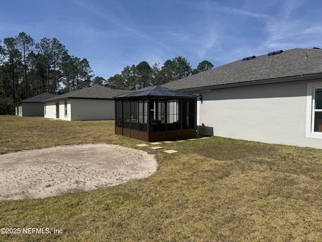 19 Slipper Flower Path E, Palm Coast, FL 32164 - view of side of property featuring a gazebo, stucco siding, a sunroom, and a yard