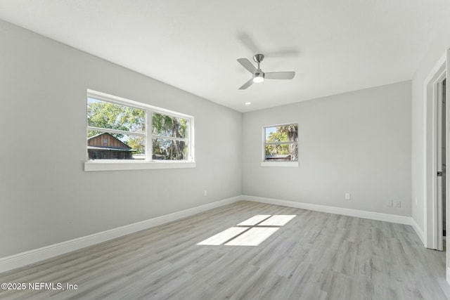 unfurnished bedroom featuring a ceiling fan, baseboards, and light wood-type flooring
