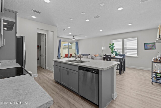 7091 Red Timber Rd, Jacksonville, FL 32244 - kitchen with gray cabinetry, light countertops, stainless steel appliances, a ceiling fan, and a sink