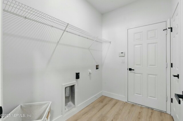 3852 Westridge Dr, Orange Park, FL 32065 - clothes washing area with baseboards, light wood-style floors, hookup for a washing machine, and laundry area