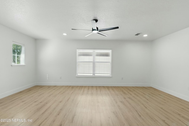 3852 Westridge Dr, Orange Park, FL 32065 - spare room with light wood finished floors, visible vents, baseboards, a textured ceiling, and a ceiling fan
