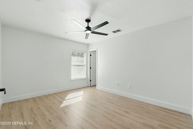 3852 Westridge Dr, Orange Park, FL 32065 - spare room featuring baseboards, a textured ceiling, a ceiling fan, and light wood finished floors