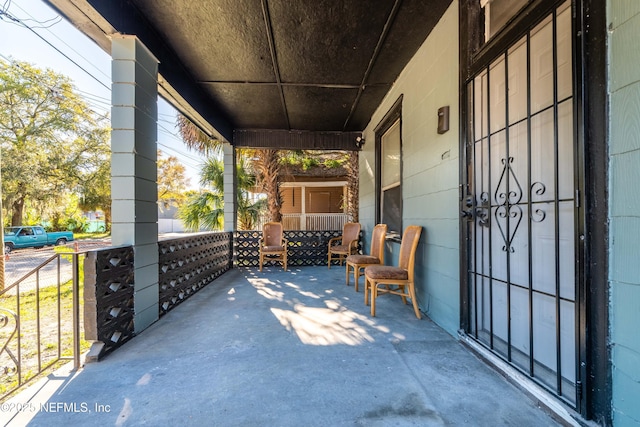 view of patio featuring a porch