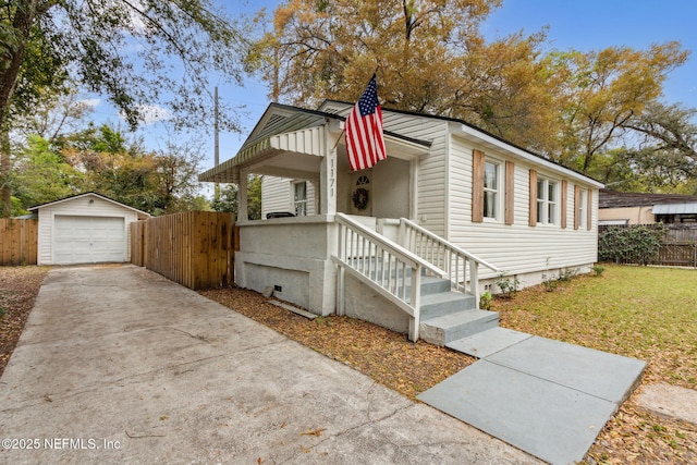 1171 Scotten Rd, Jacksonville, FL 32205 - view of front facade with an outdoor structure, driveway, fence, and a detached garage