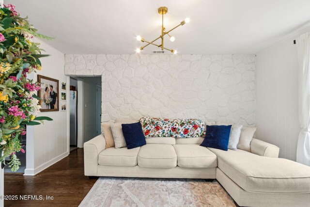 1171 Scotten Rd, Jacksonville, FL 32205 - living area featuring wood finished floors, a chandelier, and visible vents