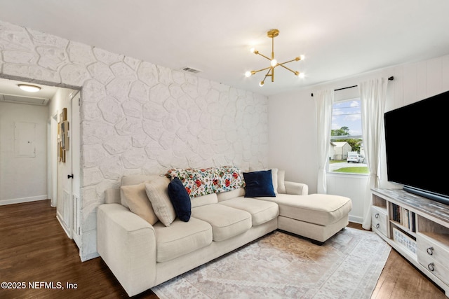 1171 Scotten Rd, Jacksonville, FL 32205 - living area with wood finished floors, baseboards, a chandelier, and visible vents