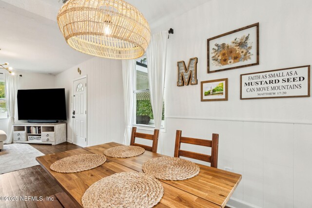 1171 Scotten Rd, Jacksonville, FL 32205 - dining space featuring an inviting chandelier, a wainscoted wall, and wood finished floors