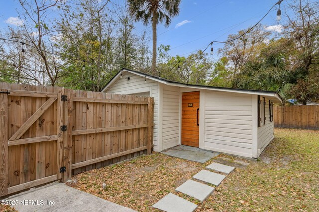 1171 Scotten Rd, Jacksonville, FL 32205 - view of outbuilding with a gate, an outbuilding, and fence