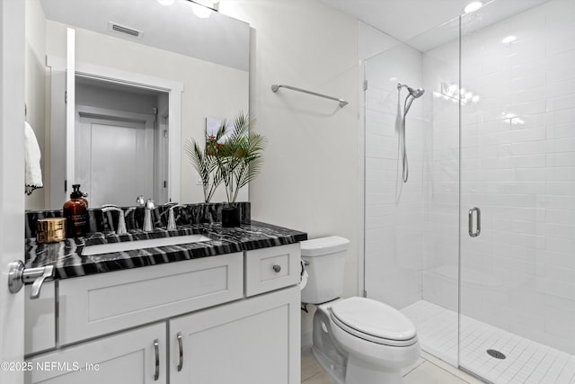 31 26th Ave S, Jacksonville Beach, FL 32250 - bathroom with toilet, visible vents, a shower stall, and vanity