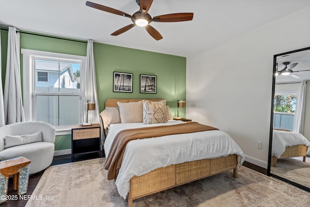 31 26th Ave S, Jacksonville Beach, FL 32250 - bedroom with baseboards, a ceiling fan, wood finished floors, and multiple windows