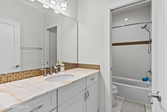 31 26th Ave S, Jacksonville Beach, FL 32250 - full bath with vanity, tasteful backsplash, toilet, and shower / washtub combination
