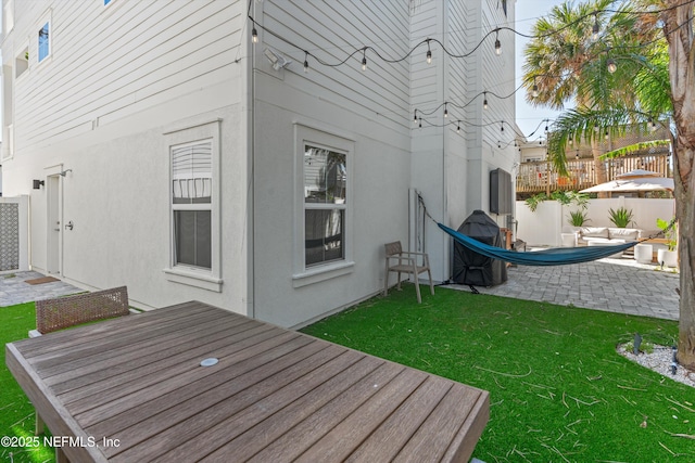 31 26th Ave S, Jacksonville Beach, FL 32250 - exterior space with a patio, a lawn, fence, and stucco siding