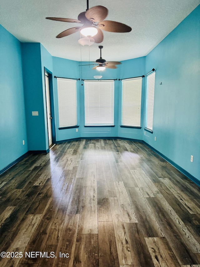 11770 Huckleberry Trl E, Macclenny, FL 32063 - unfurnished room with a ceiling fan, hardwood / wood-style flooring, a textured ceiling, and baseboards