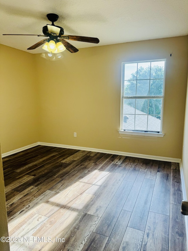 11770 Huckleberry Trl E, Macclenny, FL 32063 - spare room with ceiling fan, dark wood-type flooring, and baseboards