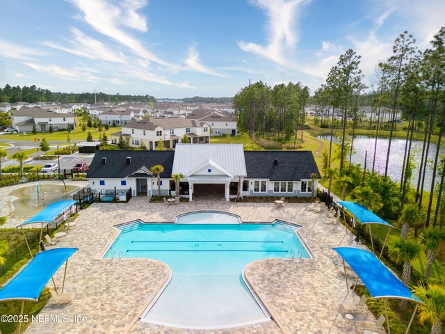 79 Coastline Way, Saint Augustine, FL 32092 - pool featuring a patio, a water view, fence, and a residential view