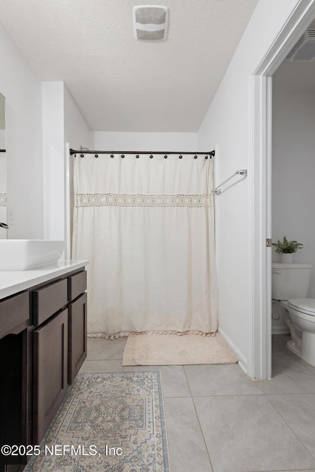79 Coastline Way, Saint Augustine, FL 32092 - bathroom featuring toilet, vanity, a textured ceiling, and visible vents
