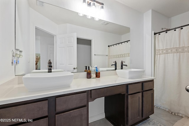 79 Coastline Way, Saint Augustine, FL 32092 - bathroom with double vanity, visible vents, a sink, and a shower with curtain