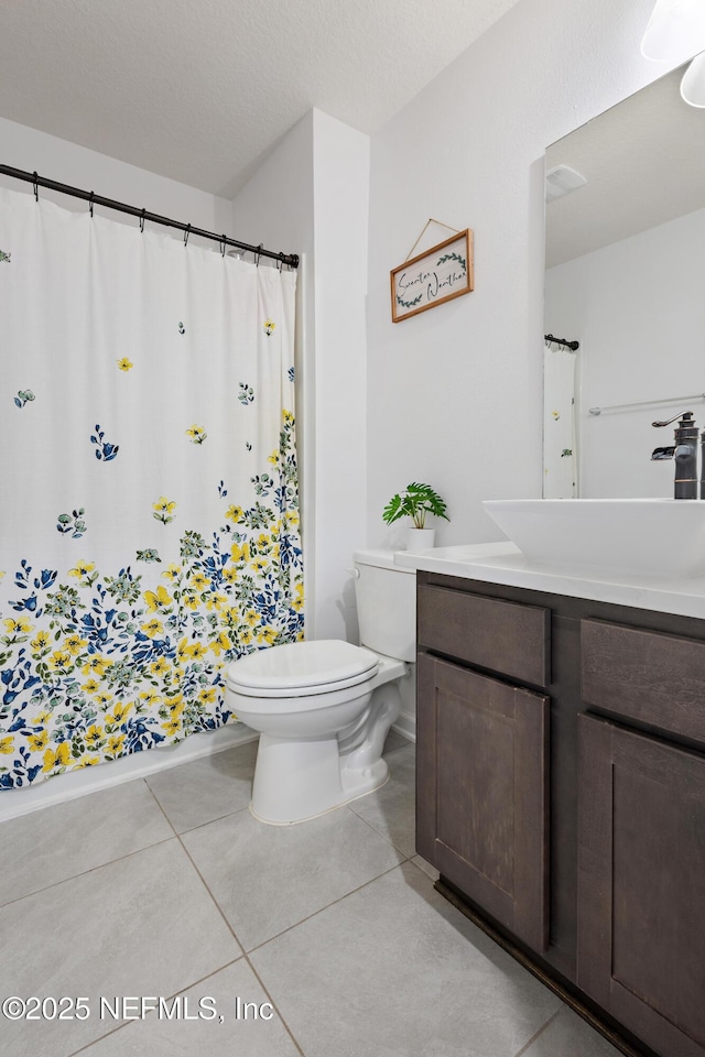 79 Coastline Way, Saint Augustine, FL 32092 - full bathroom with tile patterned floors, a shower with shower curtain, toilet, and vanity