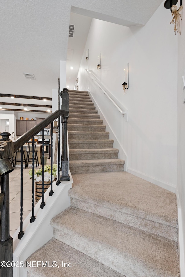 79 Coastline Way, Saint Augustine, FL 32092 - stairway with baseboards and visible vents