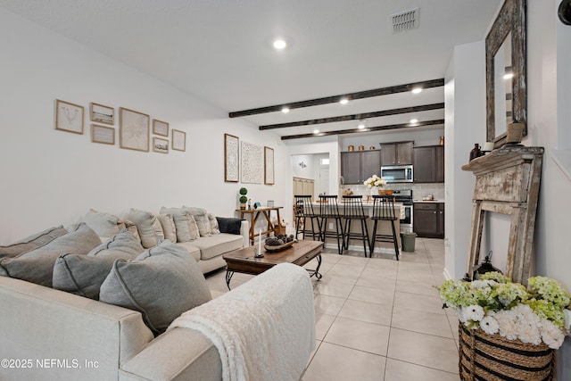 79 Coastline Way, Saint Augustine, FL 32092 - living room with light tile patterned floors, recessed lighting, beamed ceiling, and visible vents
