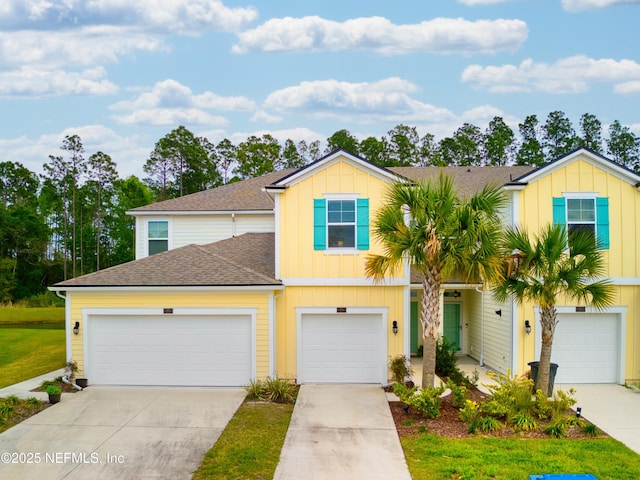 79 Coastline Way, Saint Augustine, FL 32092 - view of property featuring board and batten siding, driveway, and a shingled roof