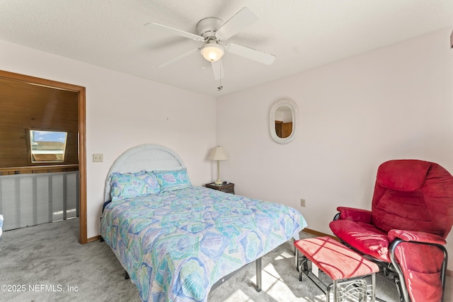 27 Flagler Dr, Palm Coast, FL 32137 - carpeted bedroom with a ceiling fan, baseboards, and a textured ceiling