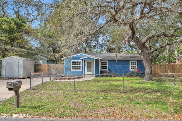 4245 New Hampshire Rd, Elkton, FL 32033 - ranch-style home with an outbuilding, a fenced front yard, a front yard, and a shed