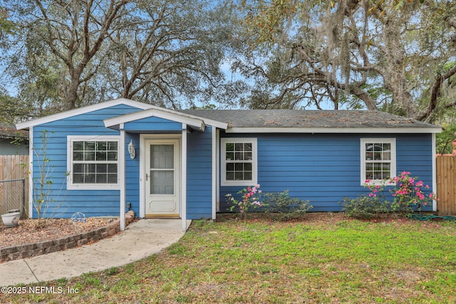 4245 New Hampshire Rd, Elkton, FL 32033 - single story home with a front lawn and fence