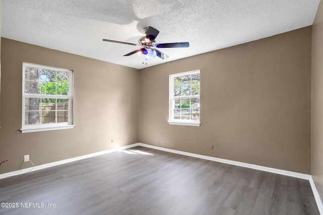 4245 New Hampshire Rd, Elkton, FL 32033 - unfurnished room with baseboards, wood finished floors, and a ceiling fan