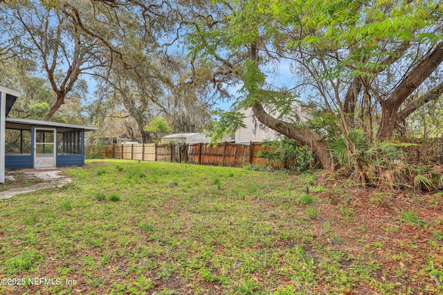 4245 New Hampshire Rd, Elkton, FL 32033 - view of yard with a sunroom and fence
