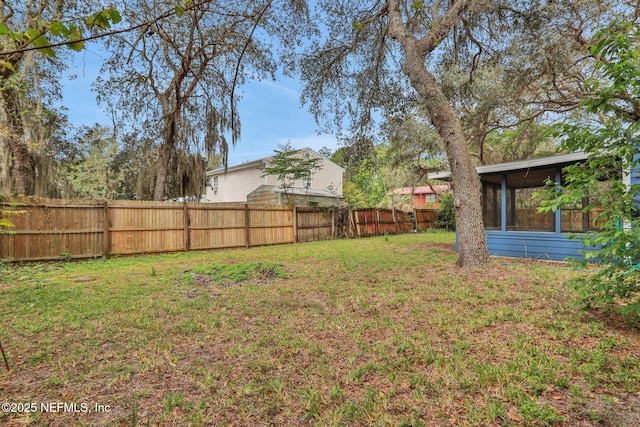 4245 New Hampshire Rd, Elkton, FL 32033 - view of yard with a sunroom and fence