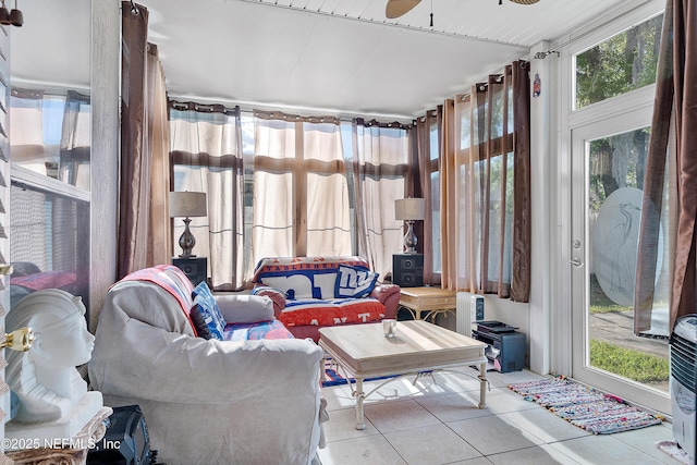 sunroom featuring tile patterned flooring
