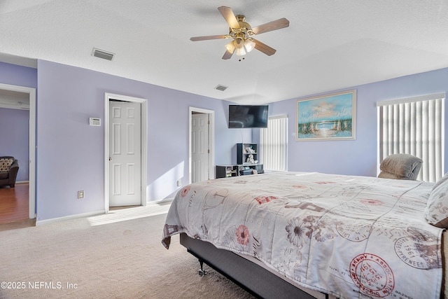 bedroom featuring multiple windows, carpet, baseboards, and visible vents