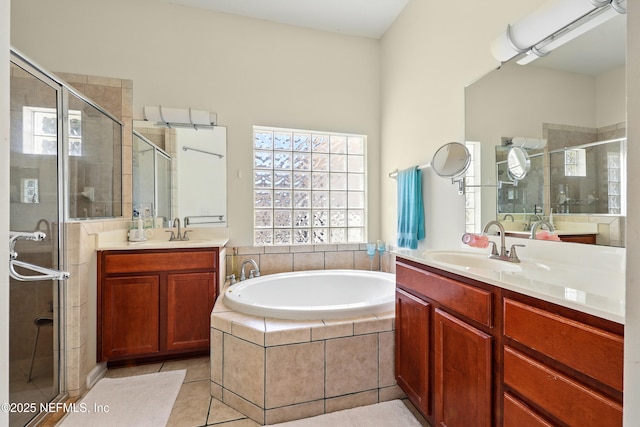 full bath featuring a shower stall, healthy amount of natural light, a bath, and tile patterned flooring