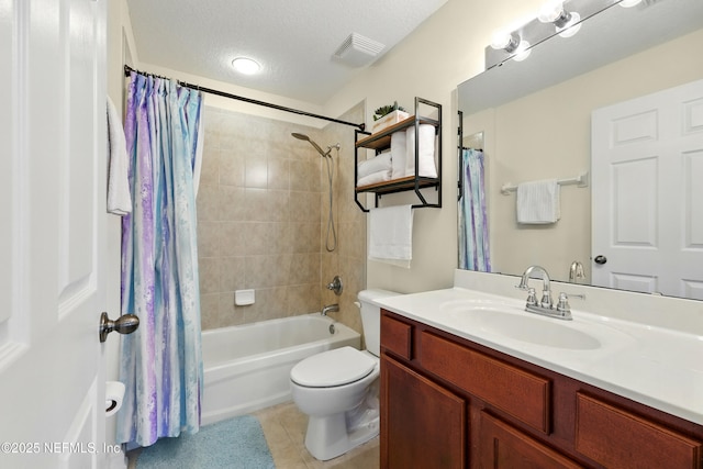 bathroom with tile patterned floors, shower / tub combo with curtain, vanity, and toilet