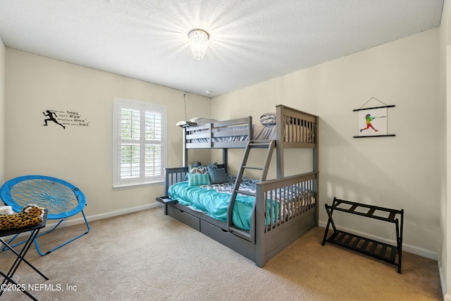carpeted bedroom with baseboards