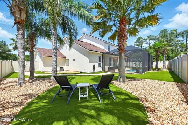 view of yard with a lanai